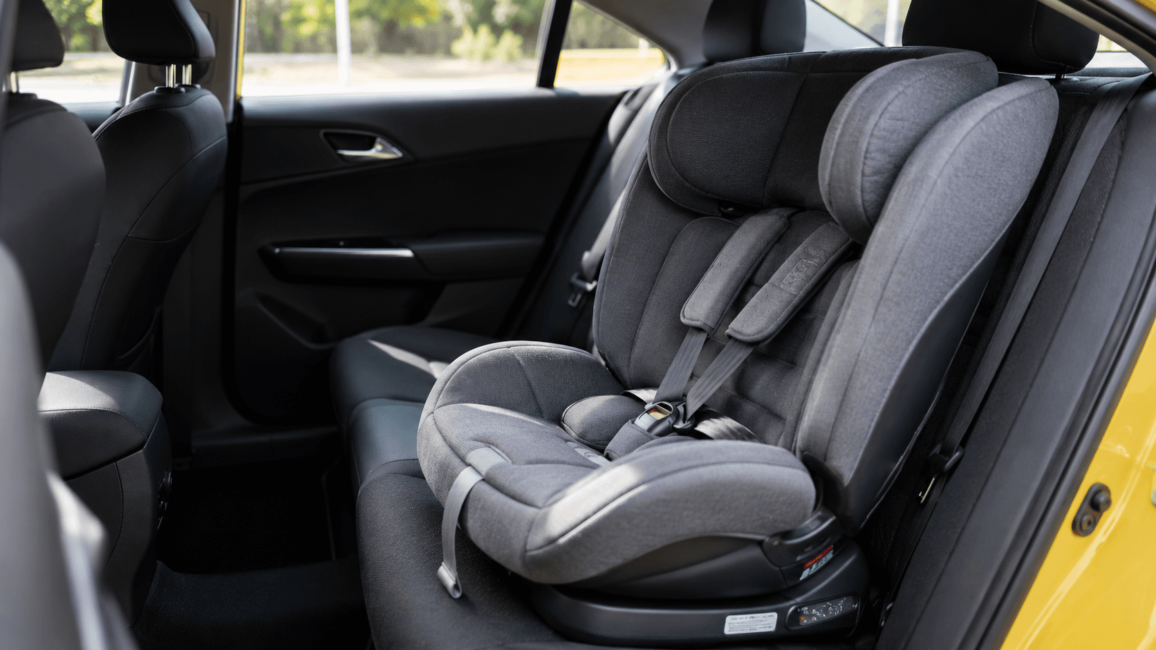 Forward-facing child car seat fitted in the rear of a clean Melbourne family taxi